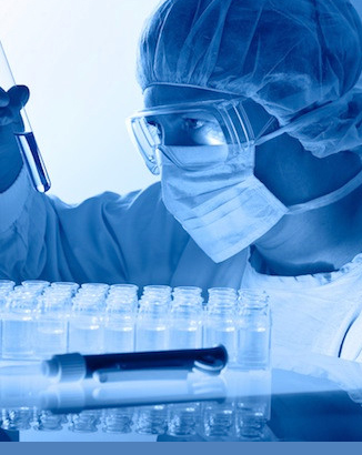 Man with test tube in lab